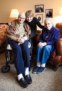 adult child with senior parents